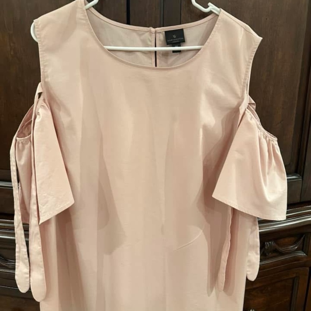 Ladies cold shoulder top color is blush/light pink